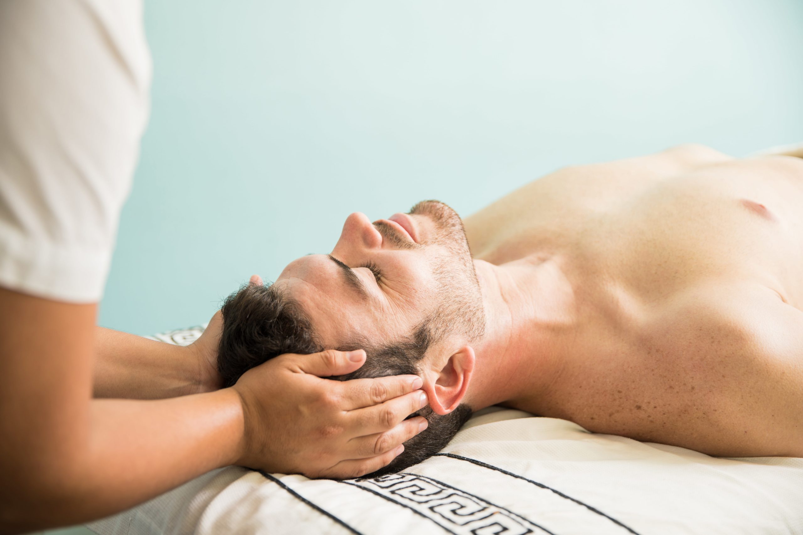profile-view-good-looking-young-man-looking-very-relaxed-while-getting-pampered-spa-min